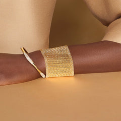 Cuff bracelet made of etheral and moving gold bars Crafted 18K yellow gold Makeda Collection