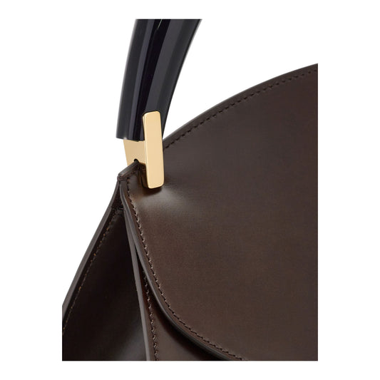 Geometric handbag with sculptural handle