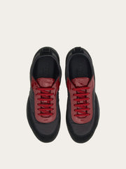 Sneaker with patent leather trim