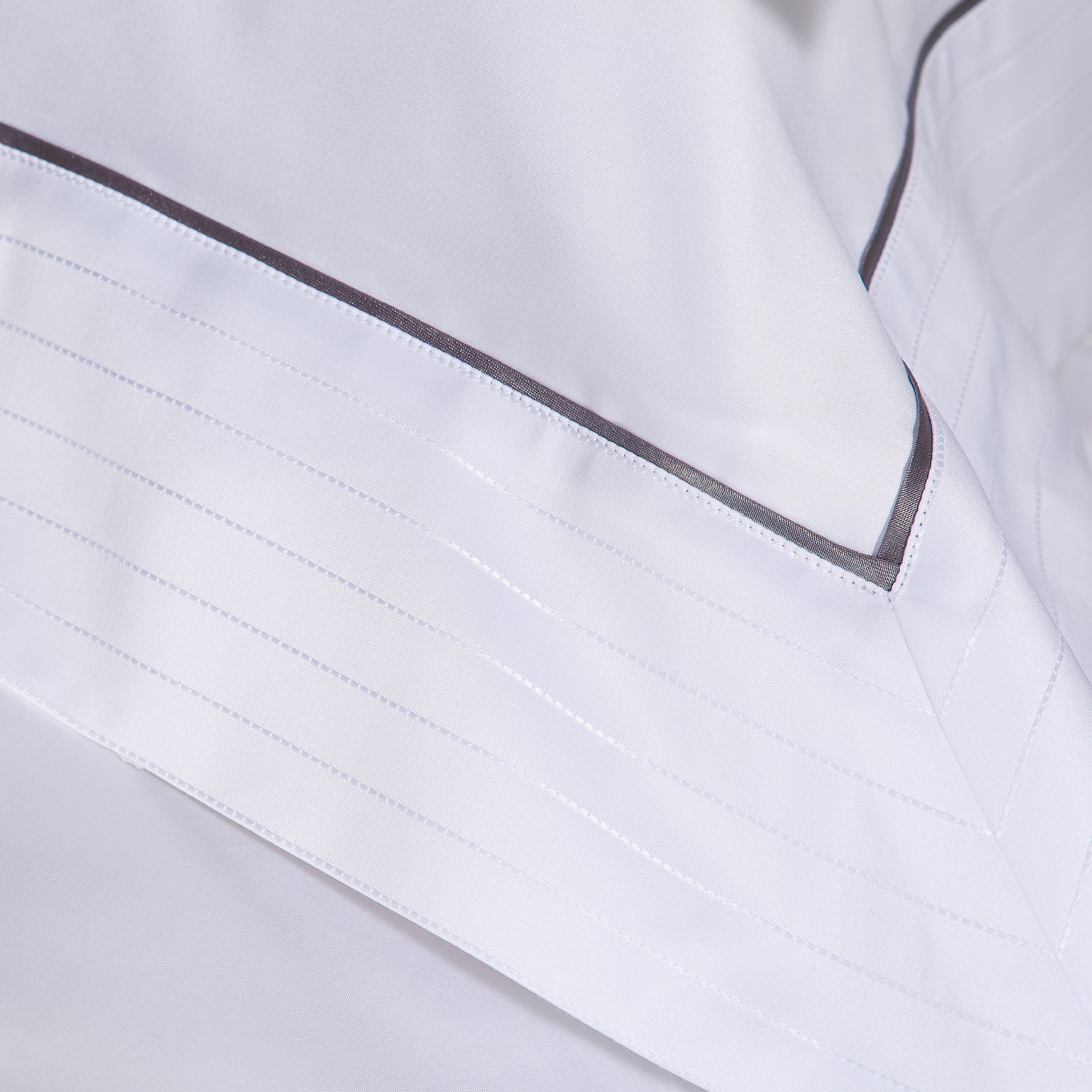 Heirlooms luxurious Sandringham cotton sateen white bedroom duvet cover and sheets set with a contrast border whose subtle self colour woven stich adds shine to your lines.