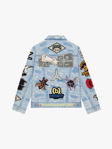 Jacket in destroyed denim with patches